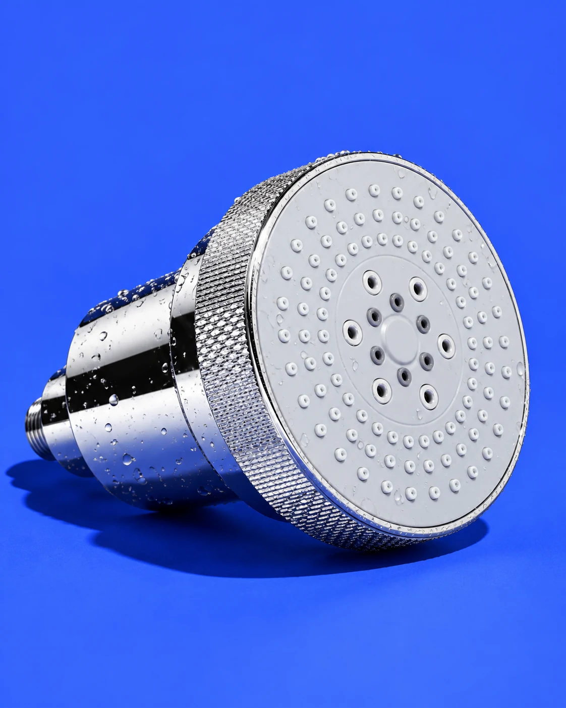 Chrome Clyr filtered showerhead on a cobalt background